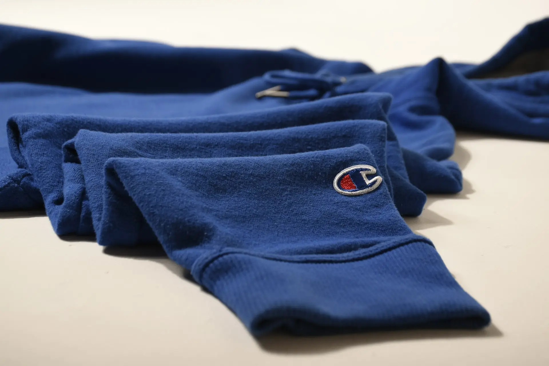 a pair of blue sweatpants laying on top of a table